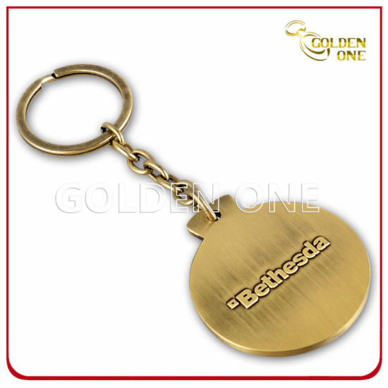 Kundenspezifischer Schlüsselanhänger aus Metall mit geprägtem Logo in Antik-Bronze-Finish