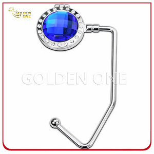 Kreatives Design Handtaschenhalter aus Metall mit blauem Edelstein